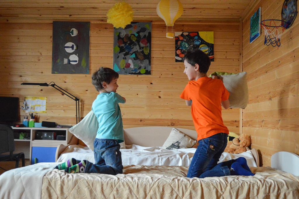 Children pillow fighting